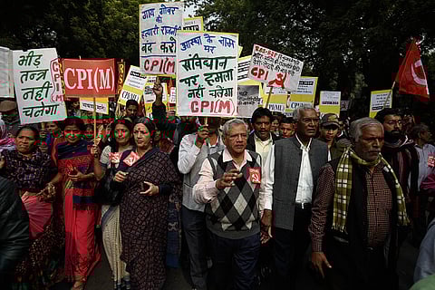 CPI-M leader Sitaram Yechury, Communist Party of India MP D. Raja and CPI (M) leader Brinda Karat along with other leaders march against the BJP
